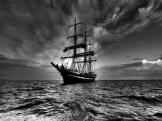 A Three-Masted Ship on the Ocean: Black and White Photograph
